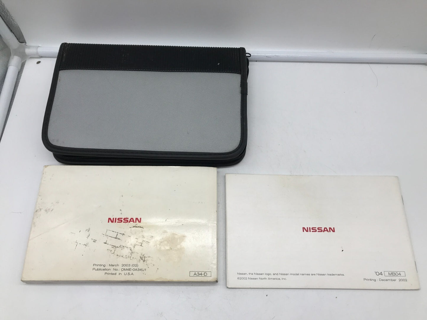 2004 Nissan Maxima Owners Manual Set with Case OEM E02B65003