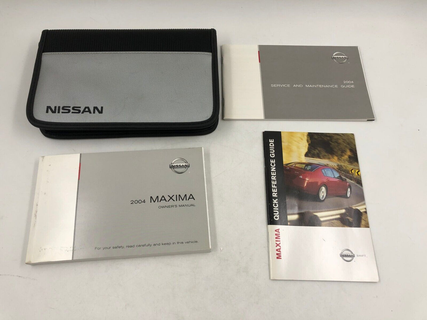 2004 Nissan Maxima Owners Manual Set with Case OEM E01B34086