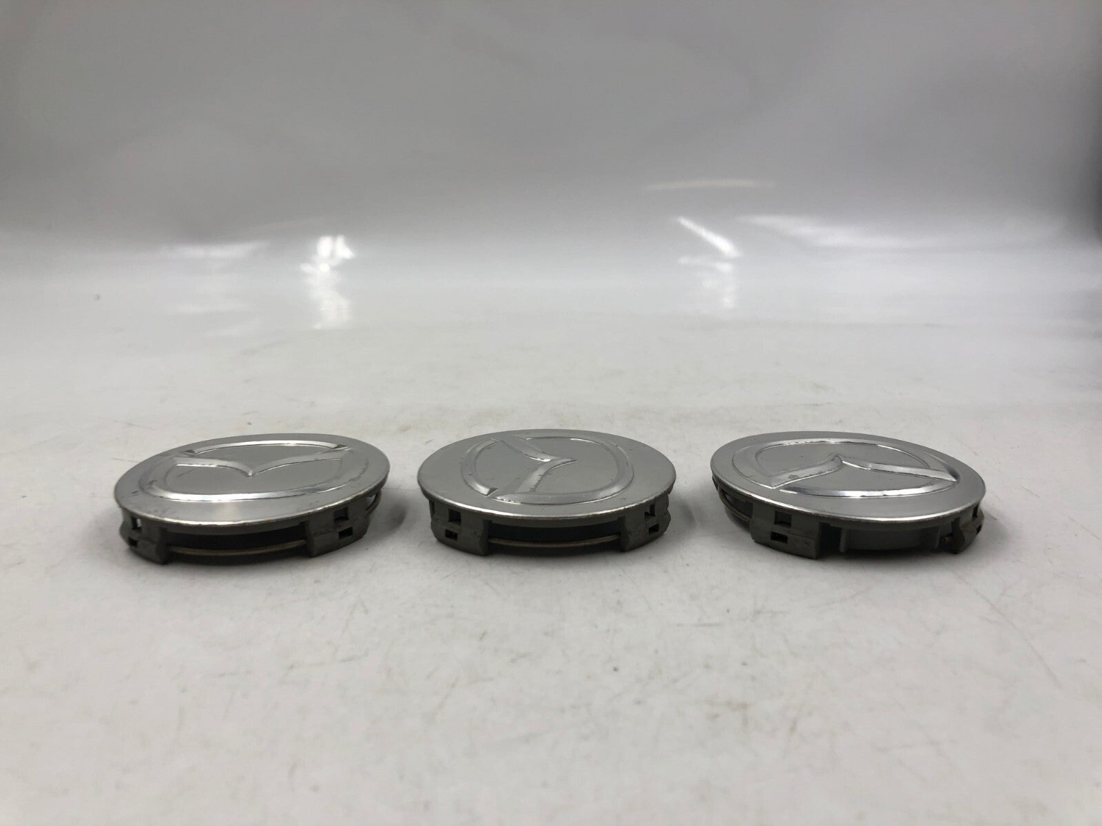 Mazda Rim Wheel Center Cap Set Silver OEM B01B34064